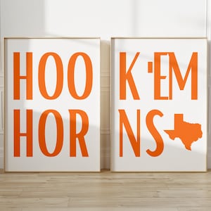 May include: Two framed prints with the text "HOOK 'EM HORNS" in orange letters. The second print also includes an orange outline of the state of Texas.