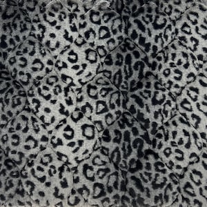 May include: Close-up of a quilted fabric with a leopard print pattern. The design features black spots on a gray background, arranged in a repeating pattern. The fabric has a soft, plush texture and a diamond-shaped quilting.