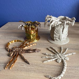 Alien Face Hugger Fidget Toy and open Egg Sac