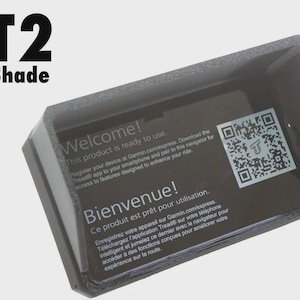 May include: A black XT2 Sun Shade with the text "Welcome! This product is ready to use." and "Bienvenue! Ce produit est prêt pour utilisation." A QR code is also visible.