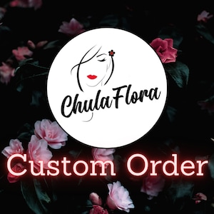 May include: A white circle with a black outline and a stylized drawing of a woman's face with a red flower in her hair. The text "Chula Flora" is written in black cursive below the woman's face. The circle is on a background of pink flowers and dark green leaves. The text "Custom Order" is written in red neon letters below the circle.