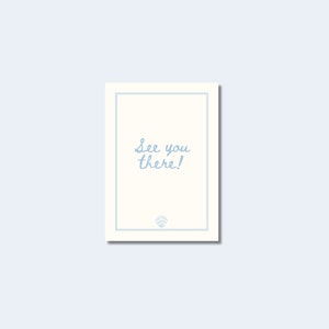 May include: A rectangular card with a cream-colored background and a light blue border. The words "See you there!" are written in cursive in light blue. A small emblem is at the bottom.