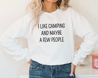 May include: White long-sleeve sweatshirt with the text "I like camping and maybe a few people" printed in black.