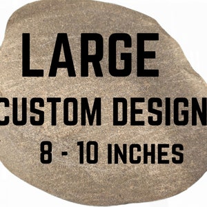 May include: A large, gray, custom design rock measuring 8 to 10 inches in diameter.