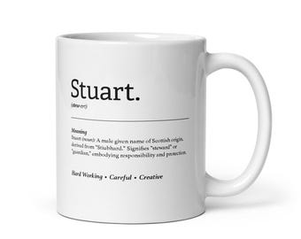May include: White ceramic mug with a black and white definition of the name "Stuart" and its meaning. The definition states that the name is of Scottish origin and means "steward" or "guardian". The mug also includes the words "Hard Working", "Careful", and "Creative".