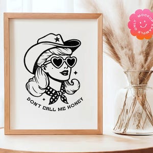May include: Black and white illustration of a woman wearing a cowboy hat, sunglasses, and a bandana. The text "Don't call me honey" is written below the image.
