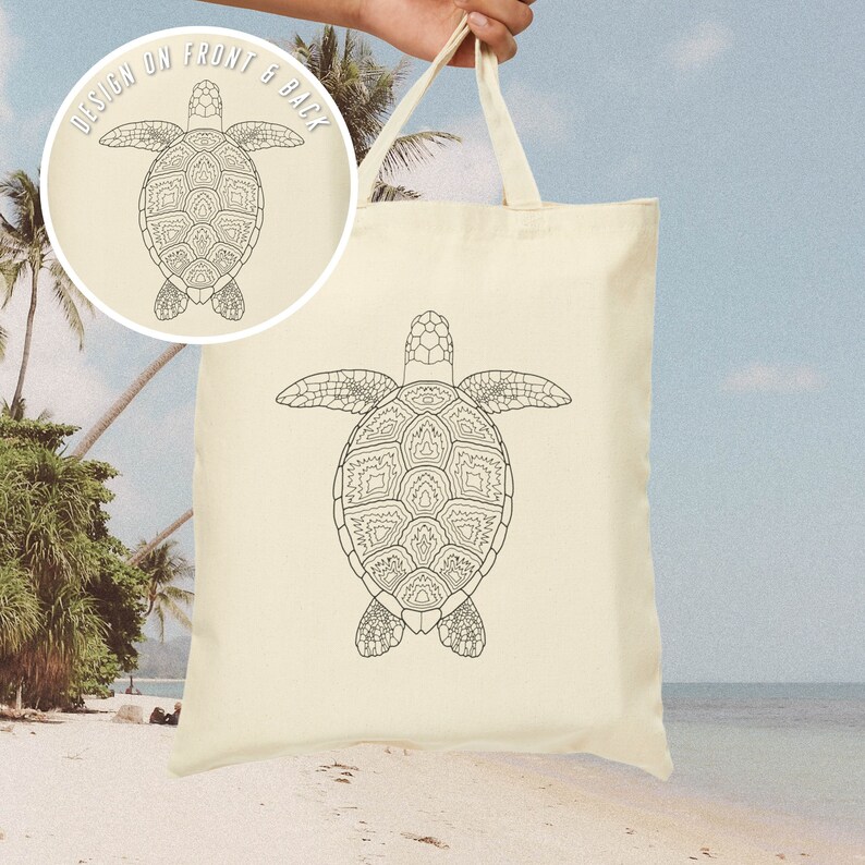 May include: A white canvas tote bag featuring a black line drawing of a turtle with a patterned shell. The text "DESIGN ON FRONT & BACK" is printed on the bag.