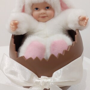 Anne Geddes 1997 porcelain baby dressed as a rabbit sitting in a chocolate egg. Great gift for Easter