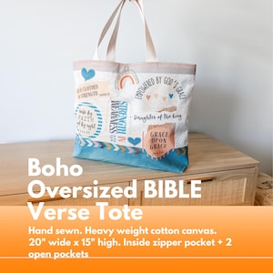 May include: A blue and white tote bag with a variety of inspirational quotes and designs. The bag is made of heavy weight cotton canvas and has a zipper pocket and two open pockets. It measures 20 inches wide by 15 inches high.