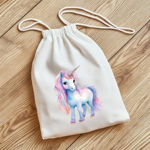 May include: White drawstring bag featuring a watercolor unicorn illustration. The unicorn has a blue body, pink and purple mane and tail, and a silver horn. The bag has a white drawstring closure.