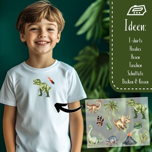 May include: A white t-shirt featuring a green dinosaur and a red comet graphic. The image also includes a selection of dinosaur-themed illustrations, suggesting designs for t-shirts, hoodies, and other items.