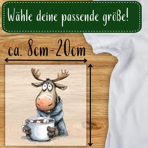 May include: A square print featuring a cartoon moose with large eyes, wearing a blue scarf, and holding a mug of hot chocolate. The print is approximately 3 to 8 inches in size. Text at the top reads "Choose your size!"