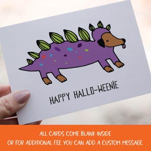 A cute and funny illustration of a dachshund dog wearing a dinosaur costume with the words happy halloweenie. Perfect greeting card for halloween and dog lovers.