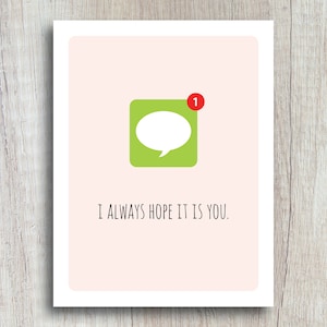 May include: A pink card with a green and white chat bubble icon with a red notification dot that says "1". The text on the card reads "I always hope it is you."