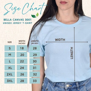 Pu&ograve; includere: Tabella delle taglie per una t-shirt in jersey unisex. La tabella mostra la larghezza e la lunghezza in pollici per le taglie S, M, L, XL, 2XL e 3XL.