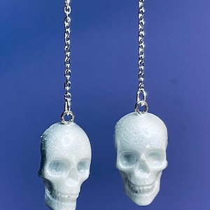 Skull drop earrings: your choice of pearlescent color and resin with sterling silver hooks.