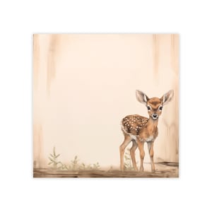 May include: A fawn with brown and white spots stands on a wooden surface with a light brown background. The fawn is looking directly at the camera.