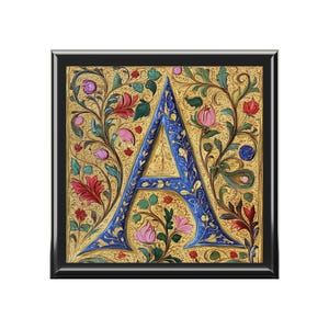 May include: A blue and gold illuminated letter A surrounded by a floral design with pink, red, and green flowers.