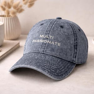 May include: A set of three ceramic mugs with a speckled, matte finish. The mugs are in shades of cream, light gray, and dark gray. Each mug has a simple, minimalist design, perfect for coffee or tea.