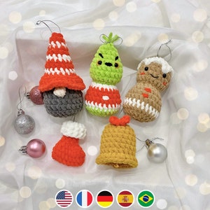May include: A set of seven crocheted Christmas ornaments, including a gnome, a gingerbread person, a Christmas tree, a bell, and three small ornaments. The ornaments are all made with different colored yarn and have a variety of textures.