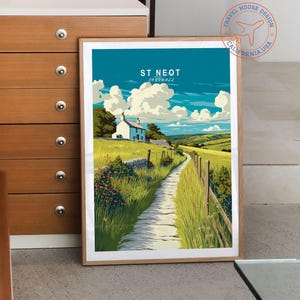 May include: A framed art print featuring a scenic landscape of St Neot, Cornwall. The artwork depicts a path leading to a white cottage, with green fields, a blue sky, and fluffy clouds. The print has a wooden frame and the text "ST NEOT CORNWALL".