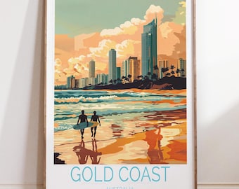 May include: A framed art print featuring a stylized depiction of the Gold Coast, Australia. The artwork showcases a beach scene with two figures carrying surfboards, silhouetted against a sunset. The print includes the text "GOLD COAST AUSTRALIA" in a light blue font.
