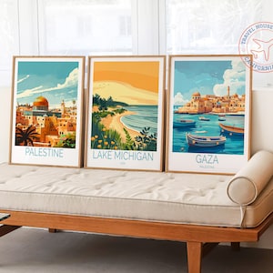 May include: Three framed travel posters with vintage-style illustrations. The posters feature scenes from Palestine, Lake Michigan, and Gaza. Each poster has a blue and white color scheme and includes the name of the location in a blue font.