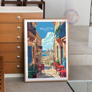 May include: A vintage travel poster featuring a colorful illustration of Valletta, Malta. The poster has a blue sky, white clouds, and a view of the city's buildings and streets. The text "VALLETTA MALTA" is printed in white on a blue background.