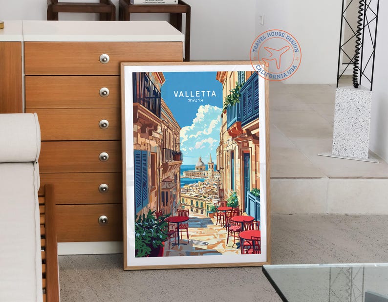 May include: A vintage travel poster featuring a colorful illustration of Valletta, Malta. The poster has a blue sky, white clouds, and a view of the city's buildings and streets. The text "VALLETTA MALTA" is printed in white on a blue background.