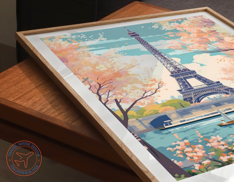 May include: A colorful illustration of the Eiffel Tower in Paris, France. The tower is surrounded by pink and white cherry blossoms and a river with a boat. The sky is blue with white clouds.