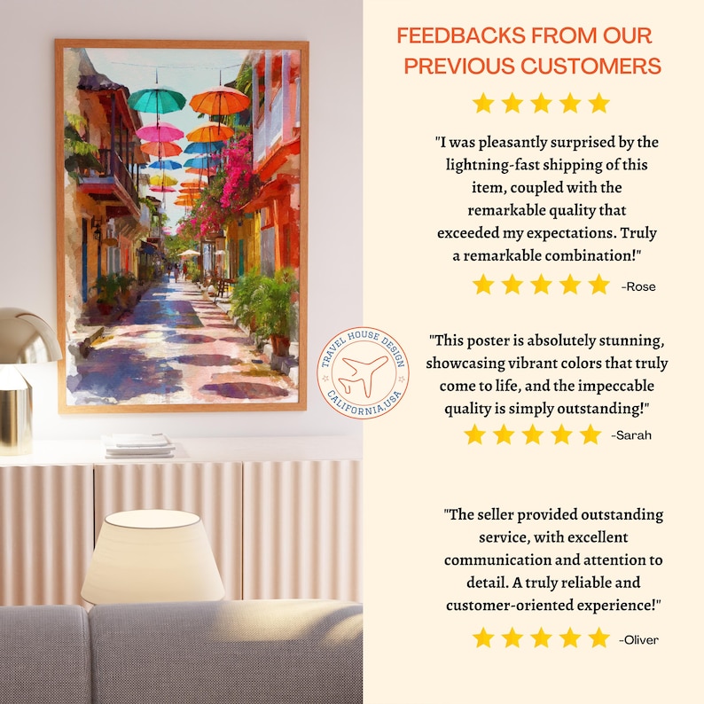 May include: A framed art print depicting a vibrant street scene with colorful buildings and parasols. The artwork features a cobblestone street and a variety of bright colors, creating a lively atmosphere. The print is from Travel House Design, California, USA.