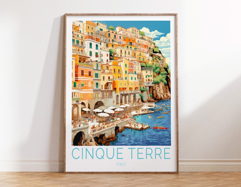 May include: A colourful illustration of the Cinque Terre region of Italy, featuring a hillside town with colourful buildings, a blue sea, and boats. The text "Cinque Terre" and "Italy" is printed below the image.