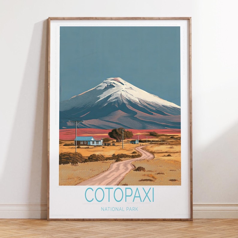 May include: A framed print of Cotopaxi National Park. The artwork depicts a snow-capped mountain under a blue sky, with a winding road leading to a small village. The text "Cotopaxi National Park" is displayed at the bottom.