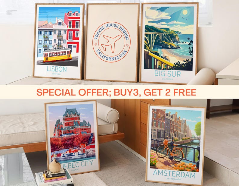 May include: Set of five framed travel art prints. The prints feature illustrations of Lisbon, Big Sur, Quebec City, and Amsterdam. One print has a Travel House Design logo. The prints are displayed on a bed and floor.