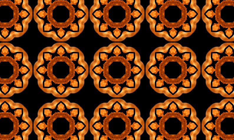 Puede incluir: Un patr&oacute;n repetitivo de formas geom&eacute;tricas naranja y negras. Las formas son circulares y tienen un dise&ntilde;o en forma de estrella.