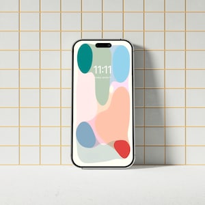 May include: A white smartphone with a black frame and a colorful abstract design on the screen. The time is 11:11.