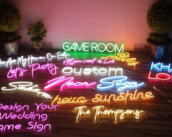 May include: A collection of custom neon signs with various phrases and designs, including "Game Room", "Let's Party", "Custom Neon Sign", "Hello Sunshine", and "The Thompsons".