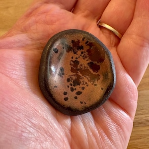 Calm stone to aid relaxation and help relieve stress. Handmade ceramic.