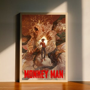 May include: A digital art print featuring a large, white, humanoid figure with a golden crown and a human figure standing inside its chest. The background is a swirling mix of gold and red. The text "MONKEY MAN" is printed in red at the bottom of the print.