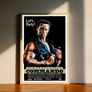 May include: A movie poster for the action film Commando starring Arnold Schwarzenegger. The poster features a black and white image of Schwarzenegger holding a gun and grenade. The text on the poster reads "Let's Party!" and "Schwarzenegger Commando".