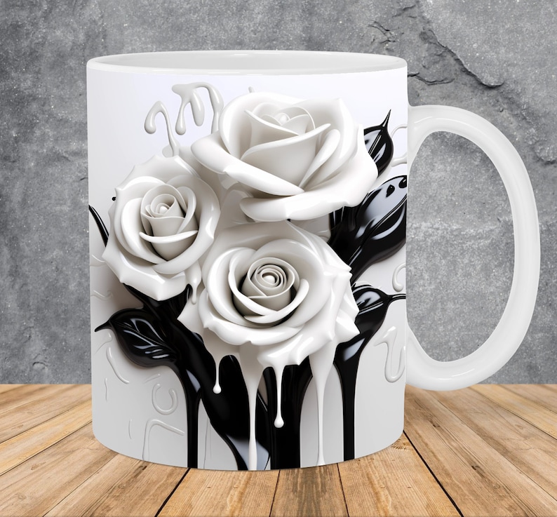 May include: White ceramic mug with a black and white design of roses dripping with black paint. The roses are in a 3D style and appear to be melting.