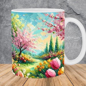 Puede incluir: Taza de cerámica blanca con una pintura colorida de un paisaje primaveral. La pintura presenta un cerezo en flor rosa, árboles verdes y un camino que conduce a través de un campo de flores amarillas y rosas.