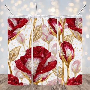 May include: A set of three stainless steel tumblers with a floral design. The design features red roses with gold stems and leaves, and a white background. Each tumbler has a silver straw.
