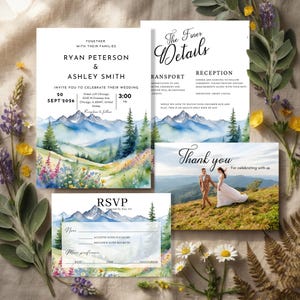 May include: A wedding stationery set featuring a watercolor mountain landscape with wildflowers. Includes an invitation for Ryan Peterson and Ashley Smith on Sept 20, 2026, a Finer Details card, an RSVP card, and a Thank You card with a photo of a couple.