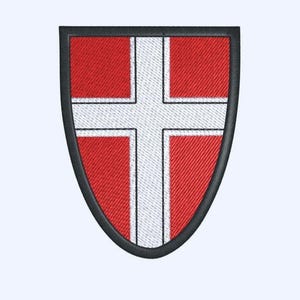 May include: Embroidered shield patch featuring a white cross on a red background, with a black border. The shield shape is slightly rounded at the bottom. The design is a classic heraldic emblem.