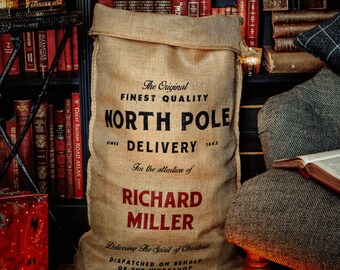 May include: A brown burlap sack with the text "The Original Finest Quality North Pole Delivery Since 1942 For the attention of Richard Miller Delivering The Spirit of Christmas Dispatched on behalf of the workshop" printed on it.