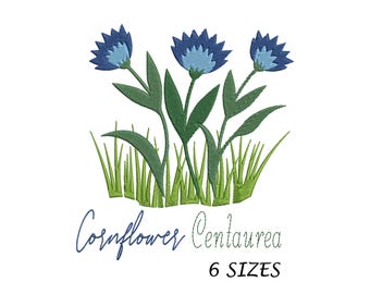 May include: Embroidered design of blue cornflowers with green leaves and grass. The text "Cornflower Centaurea 6 SIZES" is below the flowers.