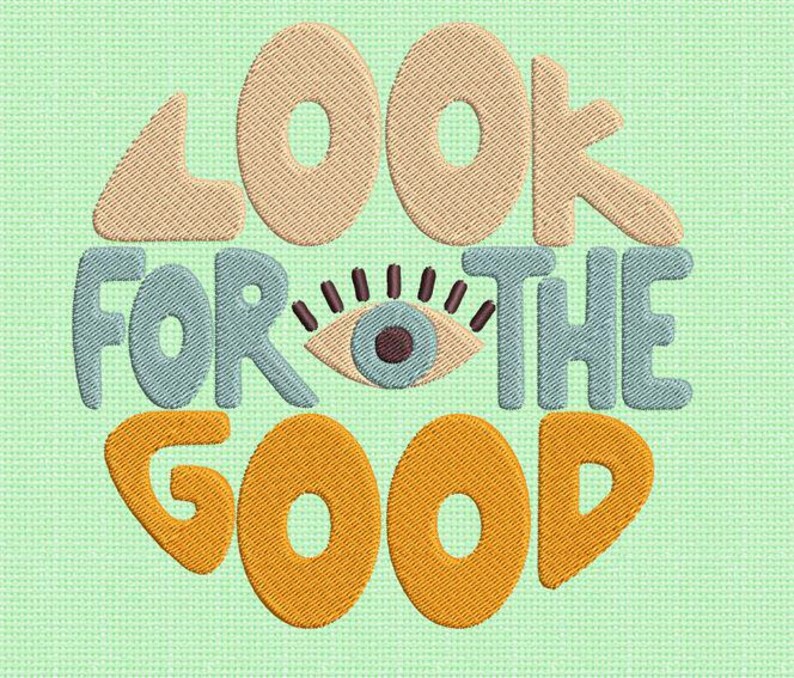 Pu&ograve; includere: Un design ricamato colorato con il testo "Look for the good" in un cerchio con un occhio stilizzato al centro.