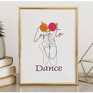 May include: Framed art print featuring a line drawing of ballet pointe shoes with the words "Love to Dance." The artwork includes orange and pink roses above the shoes. The frame is gold.
