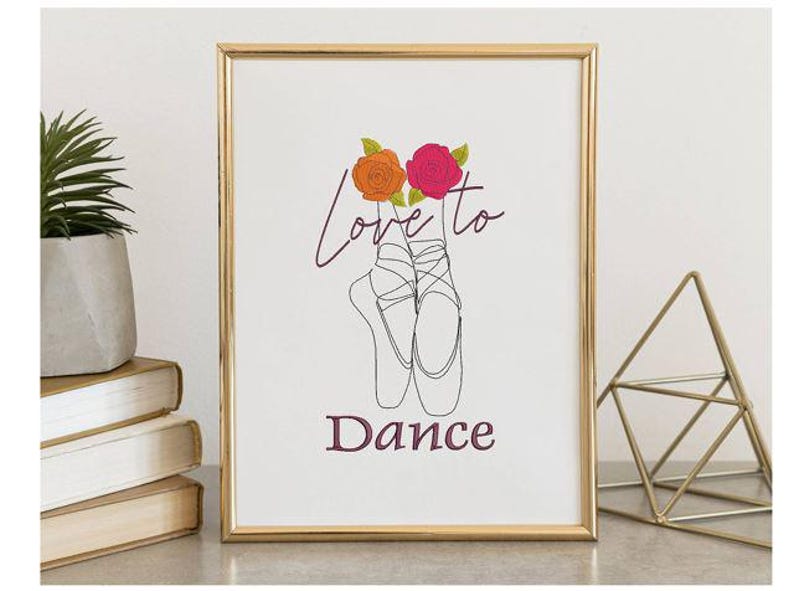 May include: Framed art print featuring a line drawing of ballet pointe shoes with the words "Love to Dance." The artwork includes orange and pink roses above the shoes. The frame is gold.